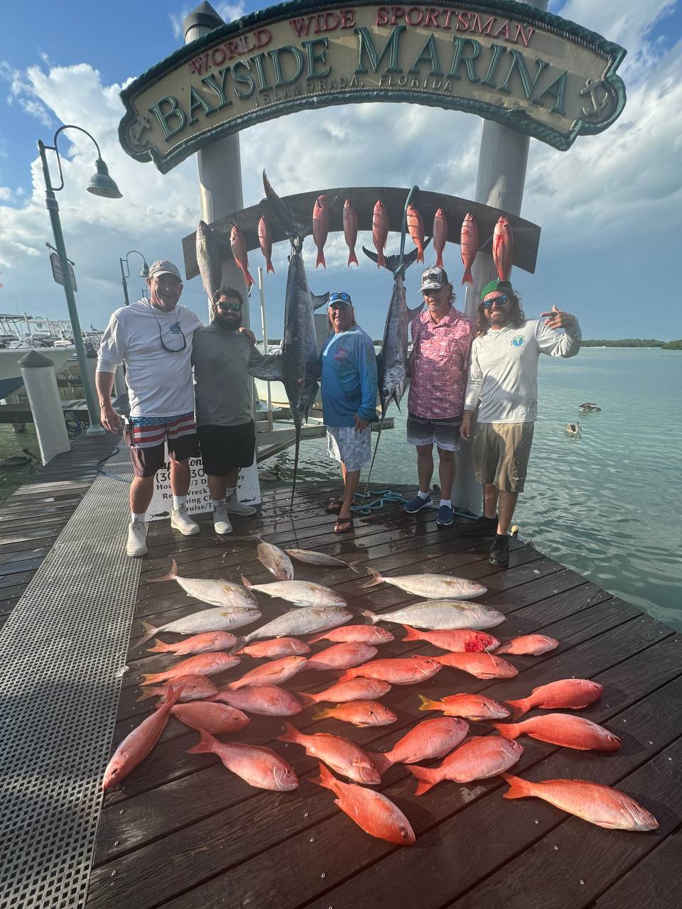 The full haul at Bayside Marina — snappers, swords, and smiles