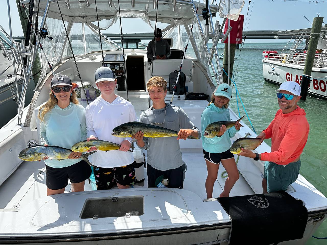 The crew with the haul โ mahi all around at the dock