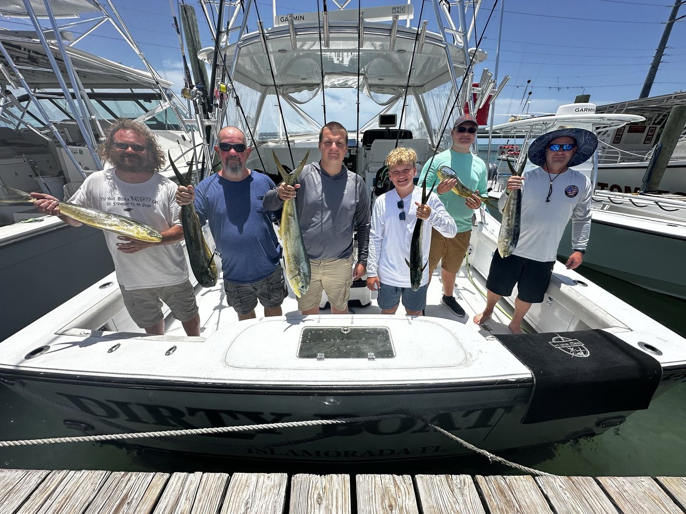 Andrew and his crew at the dock with the day's mahi
