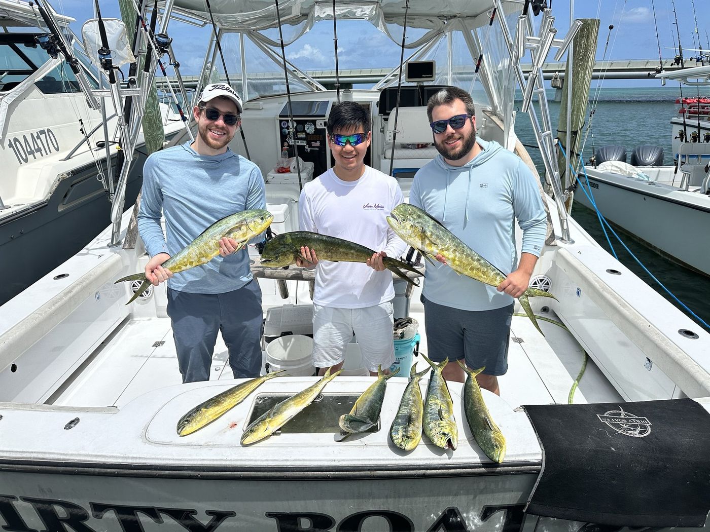Josh and his crew at the dock with the day's mahi