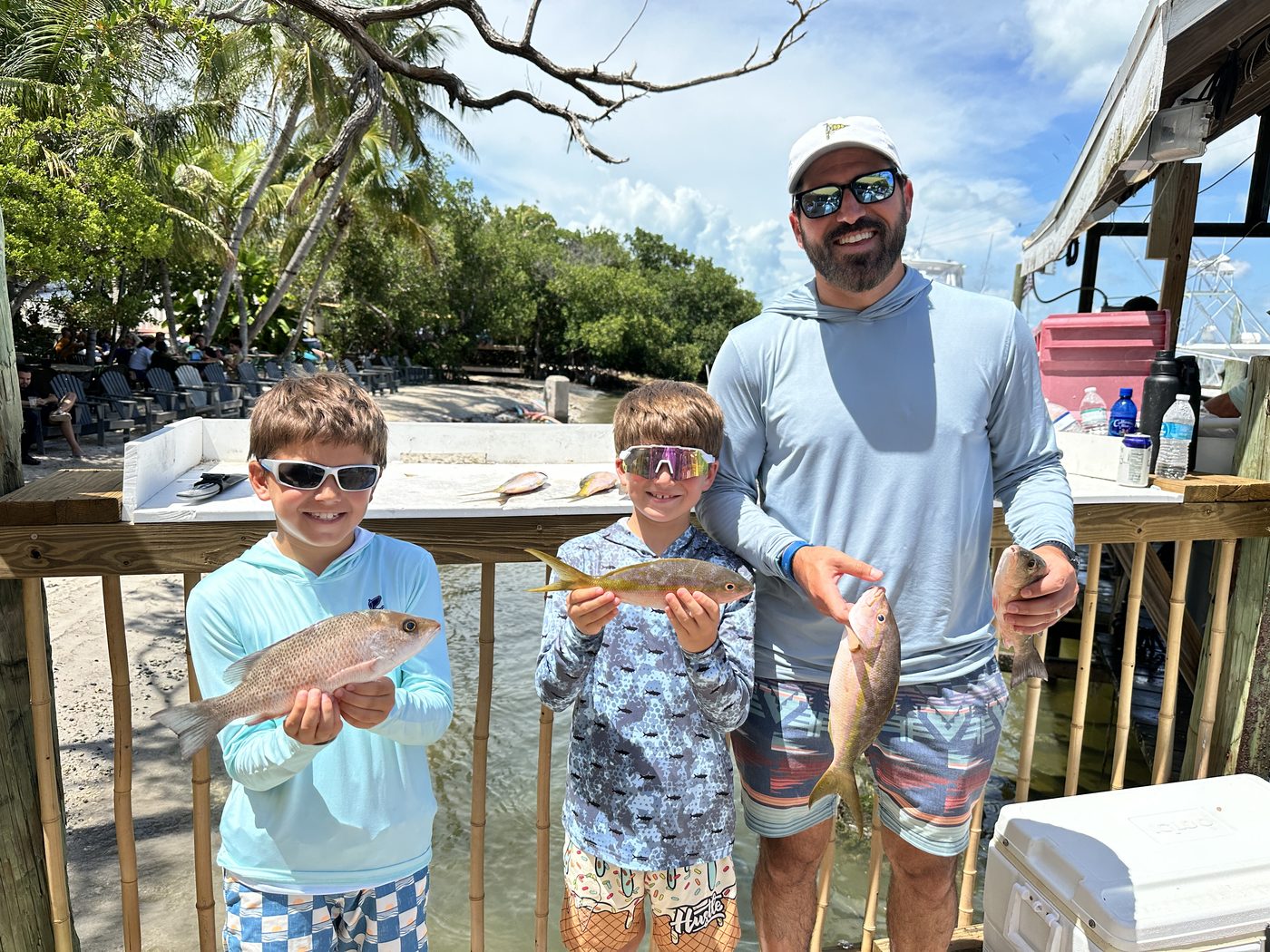 Ryan and his sons Colin and Max at the dock with their snappers