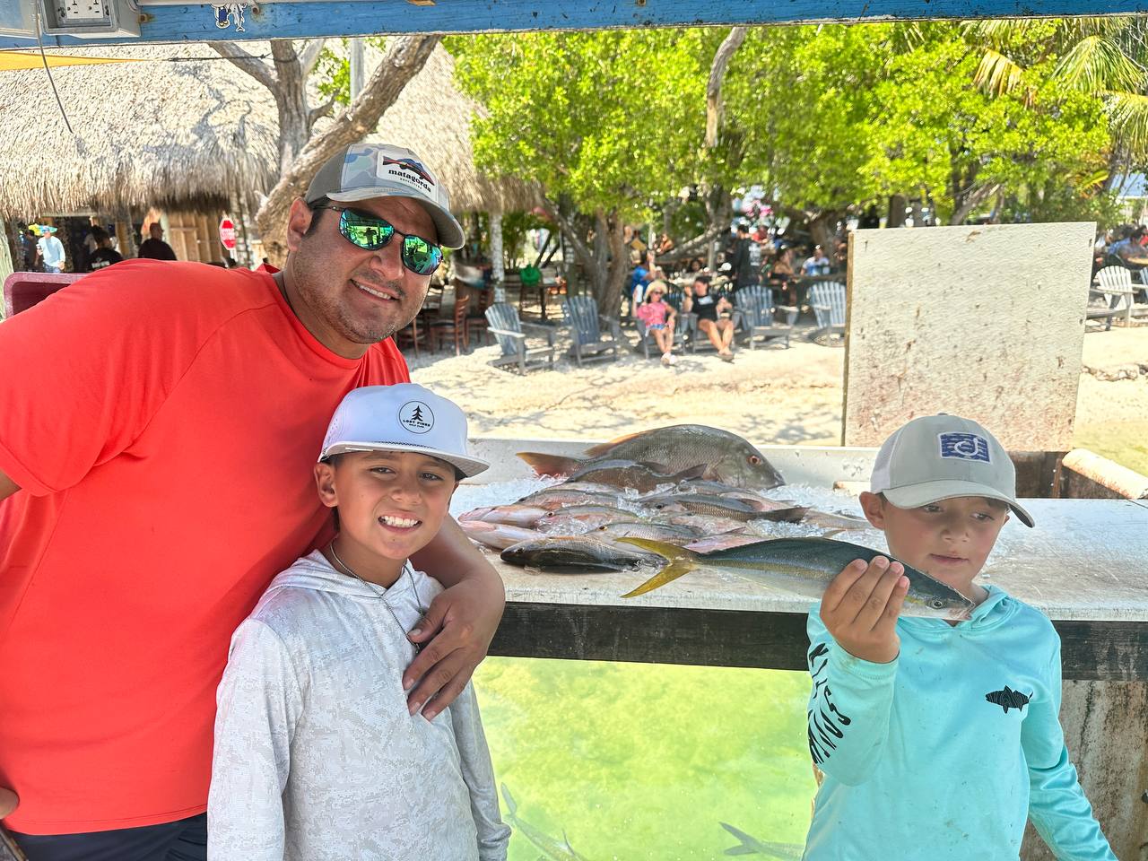 Philip with Boone and Brooks after a patch-reef snapper trip in Islamorada
